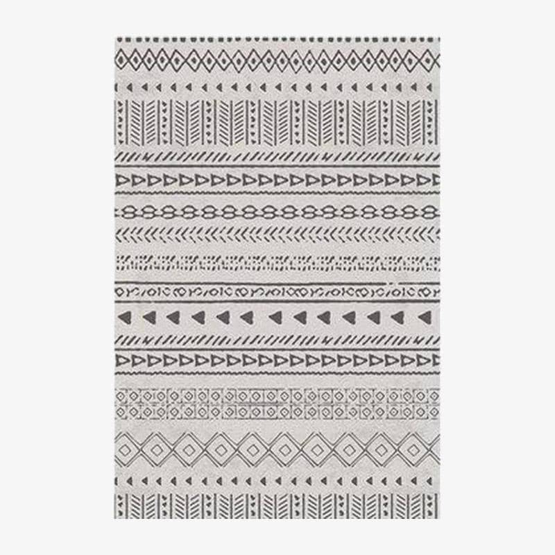 Tapis rectangle aux motifs géométriques noirs et beiges style Keecy